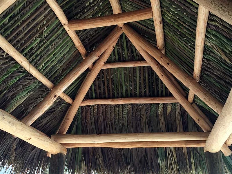 Cypress pole structure and natural thatch craftsmanship